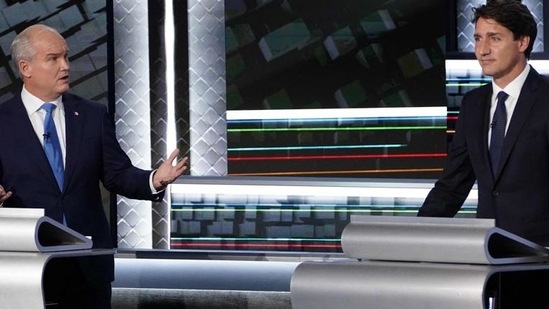 Conservative Party leader Erin O’Toole (left) and Canadian PM Justin Trudeau during a pre-election debate (AFP)