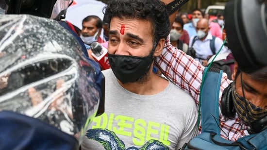 Bollywood actor Shilpa Shetty Kundra's husband Raj Kundra surrounded by media after being released on bail from the central jail for allegedly producing and broadcasting pornographic films online.(AFP)