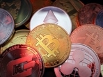 Representations of cryptocurrencies including Bitcoin, Dash, Ethereum, Ripple and Litecoin.