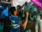 With Durga Puja just around the corner, artists all over India are giving finishing touches to the idols before they are taken to pandals, temples and homes where the rituals take place.(AP)