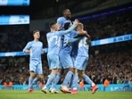 Manchester City's Cole Palmer celebrates scoring their sixth goal with teammates.
