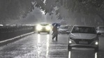 A person crosses the road during rain at Janpath on Tuesday.(Raj K Raj/HT Photo) A person crosses the road during rain at Janpath on Tuesday.(Raj K Raj/HT Photo)