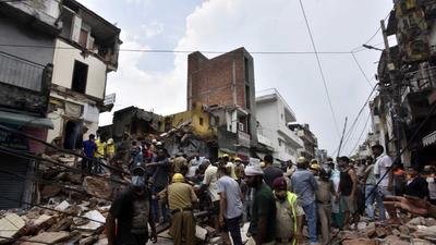 A building collapsed at Sabzi Mandi area on September 13. The North MCD had ordered a probe into the incident. The probe report has given a clean chit to four officials. (Sanjeev Verma/HT Photo) A building collapsed at Sabzi Mandi area on September 13. The North MCD had ordered a probe into the incident. The probe report has given a clean chit to four officials. (Sanjeev Verma/HT Photo)
