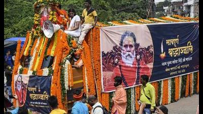 Followers of Akhil Bharatiya Akhada Parishad president Mahant Narendra Giri Maharaj gather for the ‘Nagar Yatra’ (procession) of his mortal remains prior to his ‘Bhu Samadhi’, in Prayagraj, Wednesday. (PTI Photo)
