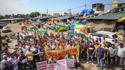 Members of traders federation stage a protest during their Jammu Bandh call against the opening of 100 Reliance retail stores in Jammu on Wednesday. (PTI) Members of traders federation stage a protest during their Jammu Bandh call against the opening of 100 Reliance retail stores in Jammu on Wednesday. (PTI)