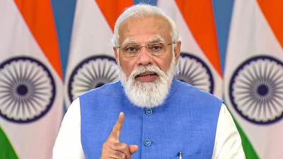 Prime Minister Narendra Modi addresses the Global Covid-19 Summit via video conferencing in Washington DC on Wednesday. (PTI PHOTO.) Prime Minister Narendra Modi addresses the Global Covid-19 Summit via video conferencing in Washington DC on Wednesday. (PTI PHOTO.)