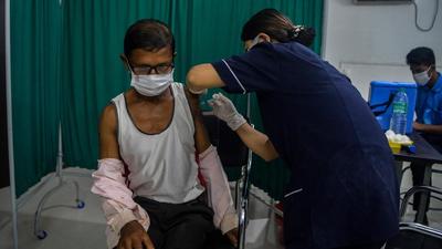 A few men from Bengal posted video clips on social media narrating their experiences of vaccination centres in their state and neighbouring Bihar (AFP Photo/Representative use) A few men from Bengal posted video clips on social media narrating their experiences of vaccination centres in their state and neighbouring Bihar (AFP Photo/Representative use)