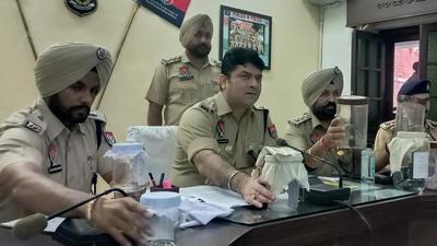 Police with seized firearms and other items in Sangrur. Another gang of robbers was busted in Dhuri, added the SSP. (HT photo) Police with seized firearms and other items in Sangrur. Another gang of robbers was busted in Dhuri, added the SSP. (HT photo)