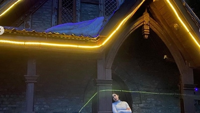 The actor poses at a church. The actor poses at a church.