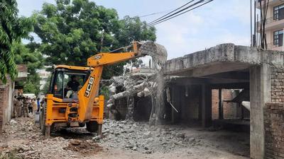 The Municipal Corporation of Gurugram (MCG) on Wednesday carried out an anti-encroachment drive in areas falling under the 900-metre radius of the Indian Air Force (IAF) ammunition depot in Sector 14 under heavy police protection. The Municipal Corporation of Gurugram (MCG) on Wednesday carried out an anti-encroachment drive in areas falling under the 900-metre radius of the Indian Air Force (IAF) ammunition depot in Sector 14 under heavy police protection.