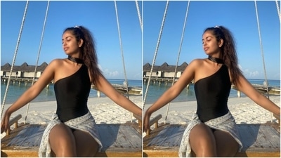 Avika added a dash of glamour to her beach vacay in this one-shoulder all-black monokini. The actor teamed the bodycon swimsuit, featuring a choker neck detail, with a printed white sarong and a sleek high ponytail. (Instagram/@avikagor)