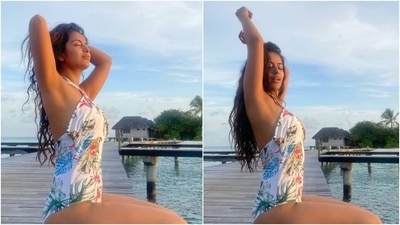Monokinis are all the rage this season, and Avika flaunted an eclectic collection during her Maldivian holiday. For this shoot by the sea, she wore floral halter neck monokini in white. The one-piece came adorned with pretty floral patterns in pink, green, and blue shades. (Instagram/@avikagor)