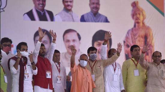 Uttar Pradesh chief minister Yogi Adityanath waves at a gathering after inaugurating a 15-foot statue of the ninth-century ruler at Mihir Bhoj Degree College in Dadri on Wednesday. (Sunil Ghosh/HT photo)