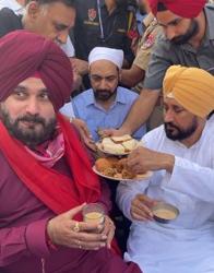 Punjab Congress chief minister Charanjit Singh Channi and state party president Navjot Singh Sidhu, who is the Amritsar East MLA, at a tea stall in the holy city. (FB) Punjab Congress chief minister Charanjit Singh Channi and state party president Navjot Singh Sidhu, who is the Amritsar East MLA, at a tea stall in the holy city. (FB)