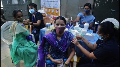 Women beneficiaries get vaccinated against Covid-19 at TMC's Tembhi Naka School, in Thane, Mumbai, on Thursday. (Praful Gangurde /HT PHOTO) Women beneficiaries get vaccinated against Covid-19 at TMC's Tembhi Naka School, in Thane, Mumbai, on Thursday. (Praful Gangurde /HT PHOTO)