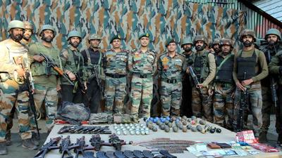 Army personnel display arms and ammunitions recovered from three militants killed in Uri area of Baramulla district on Thursday. (PTI) Army personnel display arms and ammunitions recovered from three militants killed in Uri area of Baramulla district on Thursday. (PTI)