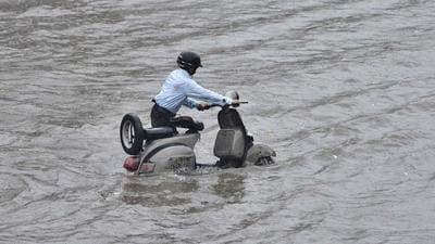 A scooterist tries to make his way through waterlogged road near Millar Gang area in Ludhiana on Thursday. The city recorded 96.4mm rain till afternoon (Gurpreet Singh/HT) A scooterist tries to make his way through waterlogged road near Millar Gang area in Ludhiana on Thursday. The city recorded 96.4mm rain till afternoon (Gurpreet Singh/HT)