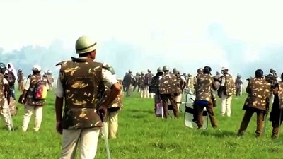 Police try to disperse protestors during an agitation against an eviction drive, in Darrang district. (Pitamber Newar) Police try to disperse protestors during an agitation against an eviction drive, in Darrang district. (Pitamber Newar)