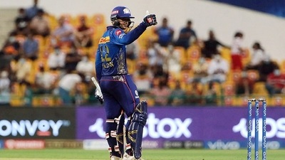 UAE, Sept 23: Quinton de Kock of Mumbai Indians celebrates his half-century during the IPL match between the Kolkata Knight Riders and the Mumbai Indians, at the Sheikh Zayed Stadium, in Abu Dhabi on Thursday. (ANI) UAE, Sept 23: Quinton de Kock of Mumbai Indians celebrates his half-century during the IPL match between the Kolkata Knight Riders and the Mumbai Indians, at the Sheikh Zayed Stadium, in Abu Dhabi on Thursday. (ANI)