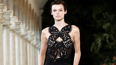 Butterfly prints and patterns on wrap skirts, lace-edged slip dresses and on fluttery minidresses highlighted the Spring 2022 collection of Alberta Ferretti.&nbsp; (REUTERS/Alessandro Garofalo)