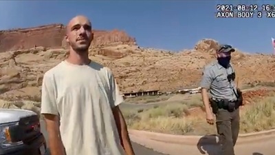  Brian Laundrie talking to a police officer after police pulled over the van he was traveling in with his girlfriend, Gabrielle "Gabby" Petito, near the entrance to Arches National Park. (AP file photo) Brian Laundrie talking to a police officer after police pulled over the van he was traveling in with his girlfriend, Gabrielle "Gabby" Petito, near the entrance to Arches National Park. (AP file photo)
