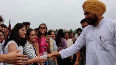 Punjab chief minister Charanjit Singh Channi, who represents the Chamkaur Sahib seat in state assembly, interacting with youngsters. There are at least 200 villages in his constituency where drone surveys will be carried out initially. (HT photo)