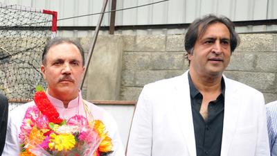 People's Conference president Sajjad Gani Lone (right) welcomes former Jammu and Kashmir Bank chairperson Parvez Ahmad Nengroo into the party fold in Srinagar on Thursday. (ANI) People's Conference president Sajjad Gani Lone (right) welcomes former Jammu and Kashmir Bank chairperson Parvez Ahmad Nengroo into the party fold in Srinagar on Thursday. (ANI)
