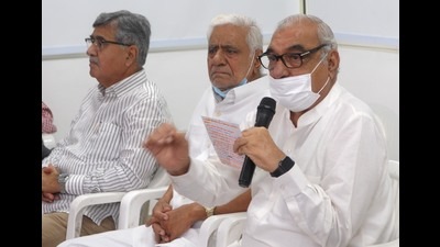 Senior Congress leader and Haryana leader of Opposition Bhupinder Singh Hooda interacting with the media at his official residence in Chandigarh on Thursday. (Ravi Kumar/HT)