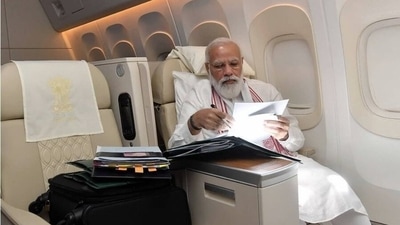 PM Modi going through files and paper work while on his way to the US. (Instagram/narendramodi) PM Modi going through files and paper work while on his way to the US. (Instagram/narendramodi)