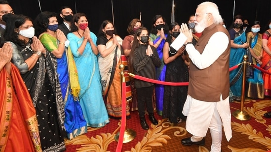 PM Modi with members of Indian-American community after landing in Washington for a three-day US visit.(Twitter/@narendramodi)