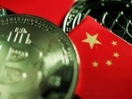 A Chinese flag is seen among representations of Bitcoin and other cryptocurrencies. (REUTERS) A Chinese flag is seen among representations of Bitcoin and other cryptocurrencies. (REUTERS)