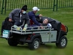 Actor Tom Felton is helped after collapsing on the 18th hole during a practice day at the Ryder Cup at the Whistling Straits Golf Course Thursday.(AP)