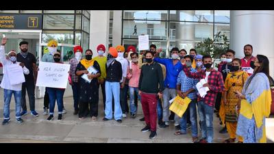 Passengers protesting outside the Chandigarh International Airport on Friday. (Keshav Singh/HT)