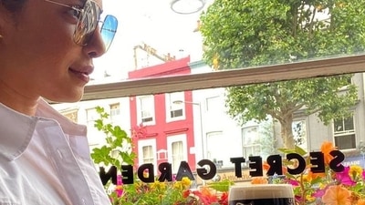 Stopping by a cafe on the way, Priyanka was seen grabbing her regular dose of caffeine as she posed by colourful flowery shrubs in the backdrop, the epitome of summer months. (Instagram/priyankachopra)
