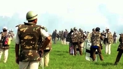 File photo of police trying to disperse protestors during an agitation against an eviction drive, in Darrang district. (Pitamber Newar)