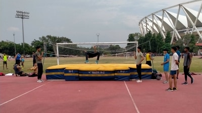 Athletes practicing high jumps without a jump stand and bar. (Avishek Roy) Athletes practicing high jumps without a jump stand and bar. (Avishek Roy)
