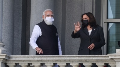 US vice-president Kamala Harris talks with Prime Minister Narendra Modi on the balcony of the Eisenhower Executive Office building at the White House complex in Washington.&nbsp; (Evelyn Hockstein / REUTERS)