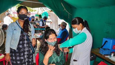 A beneficiary receives a dose of Covid vaccine in Kullu district on Friday. Union health ministry is making plans to celebrate India administering 1 billion Covid vaccine doses by early October. (PTI) A beneficiary receives a dose of Covid vaccine in Kullu district on Friday. Union health ministry is making plans to celebrate India administering 1 billion Covid vaccine doses by early October. (PTI)