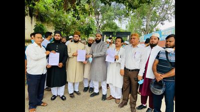 Members of civil societies in Aligarh registering their protest against arrest of Maulana Kaleem Siddiqui, who has been arrested in religious conversion racket case. (HT Photo) Members of civil societies in Aligarh registering their protest against arrest of Maulana Kaleem Siddiqui, who has been arrested in religious conversion racket case. (HT Photo)