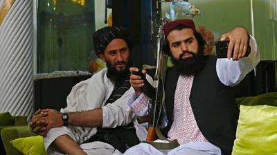 Taliban fighters take their selfie with a mobile phone inside the home of the Afghan warlord Abdul Rashid Dostum in the Sherpur neighborhood of Kabul. (AFP) Taliban fighters take their selfie with a mobile phone inside the home of the Afghan warlord Abdul Rashid Dostum in the Sherpur neighborhood of Kabul. (AFP)