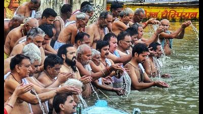 People perform ‘Tarpan’ for the remembrance of their ancestors on the bank of the Ganga river during ‘Pitri Paksha’, at Assi Ghat, in Varanasi on Friday (ANI Photo)
