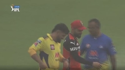 MS Dhoni and Virat Kohli walk away after sandstorm arrives in Sharjah
