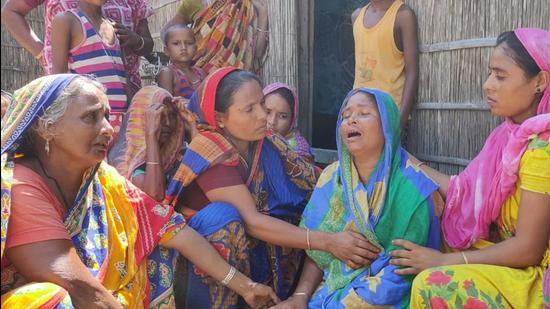 Deceased Shakh Farid’s mother (second from right) being consoled by relatives and neighbours on Friday. Day after the violence in Assam, many residents recall the horror. (Utpal Parashar HT Photo)