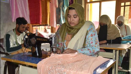 Kashmiri entrepreneur Tawheeda Akthar has empowered several unskilled women at her boutique and training centre. (Waseem Andrabi/HT)