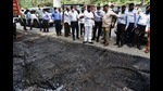 Thane Guardian Minister, Eknath Shinde (centre) during a survey of Thane roads filled with potholes on Friday. He gave directives to TMC to take action against concerned officials for poor road conditions. (PRAFUL GANGURDE/HT PHOTO) Thane Guardian Minister, Eknath Shinde (centre) during a survey of Thane roads filled with potholes on Friday. He gave directives to TMC to take action against concerned officials for poor road conditions. (PRAFUL GANGURDE/HT PHOTO)