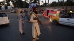 Taliban fighters stand guard along a road in Herat.(AFP) Taliban fighters stand guard along a road in Herat.(AFP)