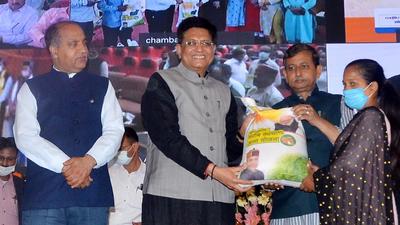 Piyush Goyal, Union minister for consumer affairs, food and public distribution, and Himachal chief minister Jai Ram Thakur distributing ration kits during a state-level function of Pradhan Mantri Garib Kalyan Ann Yojana in Shimla on Saturday. (Deepak Sansta/HT)