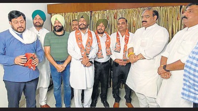 State BJP chief Ashwani Sharma inducting leaders from other parties at Circuit House in Ludhiana on Saturday. (HT Photo)