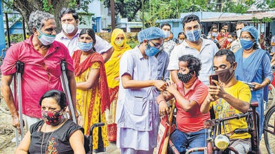 Physically-challenged persons gather at during a special Covid- 19 vaccination camp, in West Bengal’s Nadia district, on Saturday. (PTI) Physically-challenged persons gather at during a special Covid- 19 vaccination camp, in West Bengal’s Nadia district, on Saturday. (PTI)