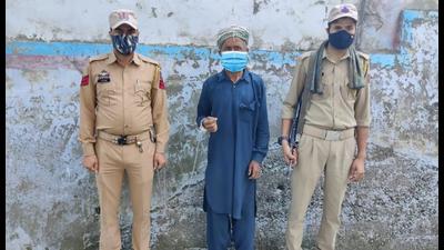 The militant who was on the run for 19 years in Kishtwar police custody on Saturday. (HT PHOTO)
